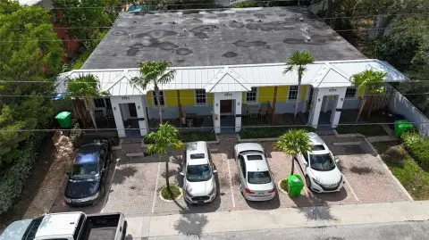 Sunrise Triplex with Private Backyards