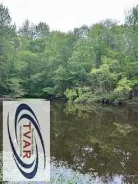 Land with Pond Near Lake