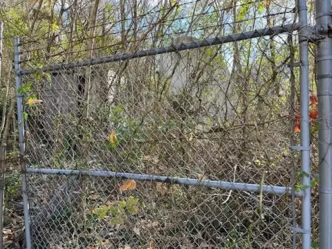 Vacant Fenced Lot in War