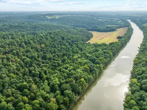 Expansive Farmland with Green River Views