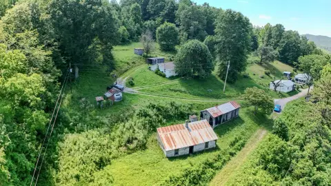 Acreage with Outbuildings and Home