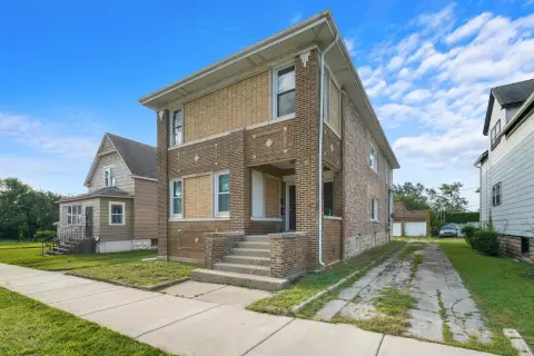 Rehabilitated Duplex with Three-Car Garage