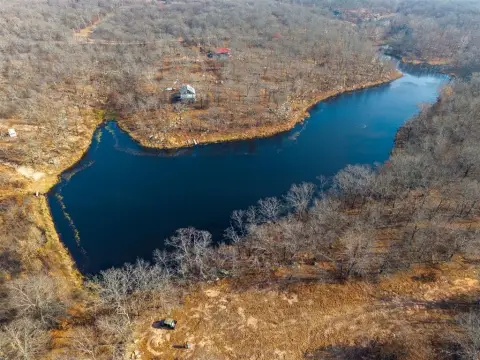 Secluded Land with Pond and Timber