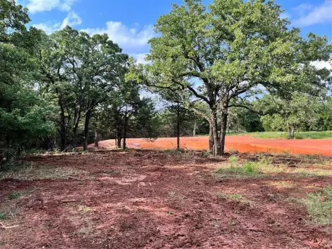 Harrah Acreage with Pond
