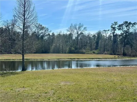Parklike Land Overlooking Pond