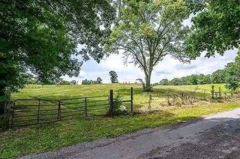 Unrestricted Fenced Land with Pond
