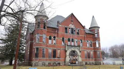 Three-Story Brick Building in Sidney, NY