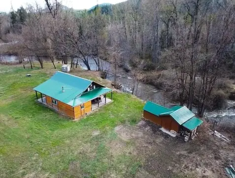 Land with Cabin and Creek