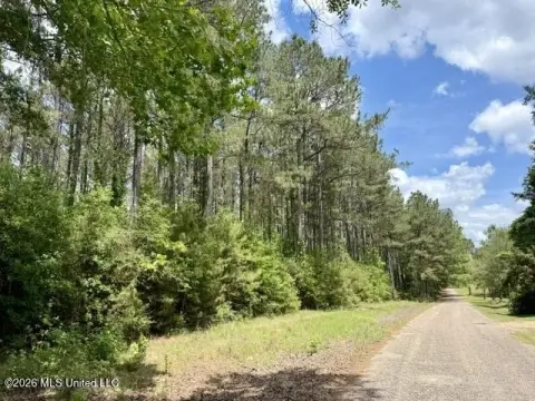 Wooded Hunting Land with Barns