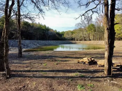 Land with Pond Near Lake