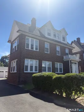 Brick Triplex With 4-Car Garage