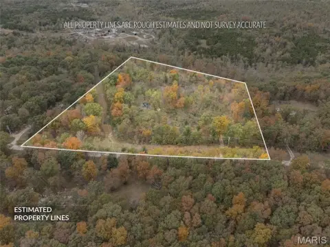 Partially Wooded Land with Pond