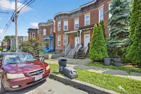 Brick Duplex with Bay Windows