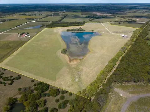 70.3 Acres with Pond and Building
