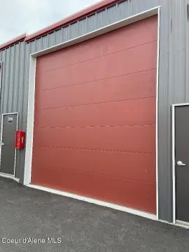 Fenced Warehouse Unit with Roll-Up Door