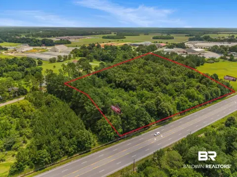 Wooded Commercial Land With Dual Frontage