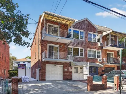 Brick Duplex With Attached Garage