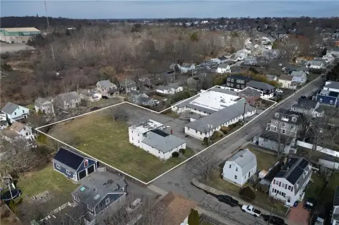 Commercial Land with Existing Buildings