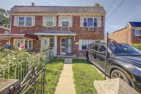 Brick Duplex With Three-Car Parking