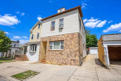 Duplex with Five Detached Garages