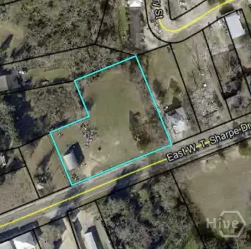 Fenced Commercial Land With Building