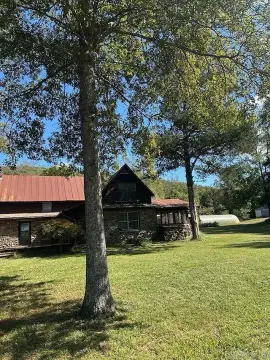 Mulberry Riverfront Acreage with Historic Cabins
