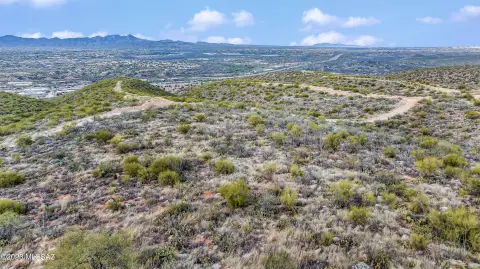 Land with Mountain and City Views
