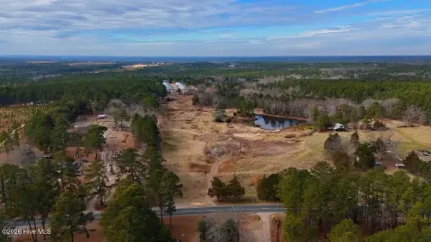 Versatile Acreage with Pond and Timber