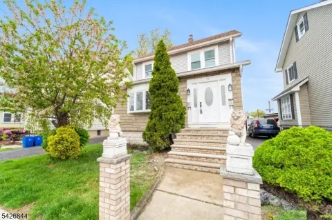 Renovated Two-Family Home with Private Backyard