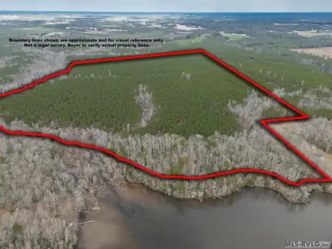 150 Acres Bordering County Pond