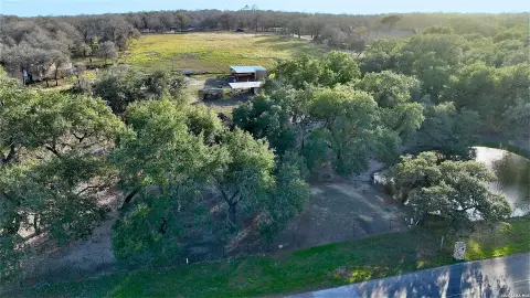 Heavily Treed Land with Pond