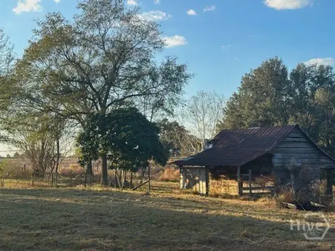 Picturesque Land with Pond and Barn