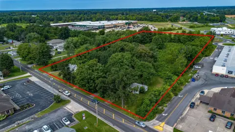 Commercial Land with Flat Semi-Wooded Acreage