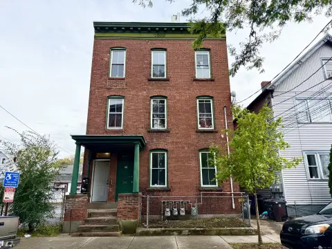 Hill Section Brick Three-Family