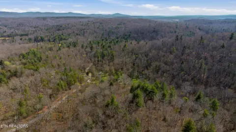 Acreage with Gas Wells and Creek