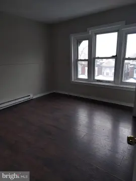 Germantown Triplex in Improving Area