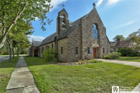 Stone Church with Stained-Glass Windows
