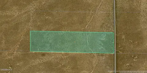 Desert Land Along Paved Road