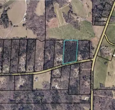 6.9 Acres Wooded Land