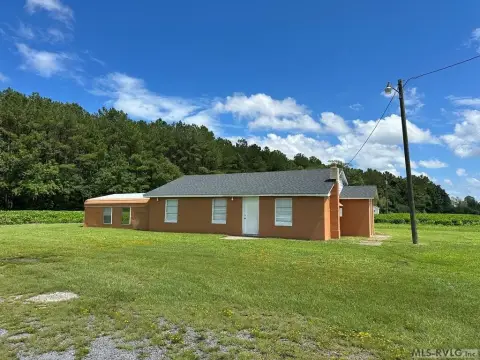 Concrete Block Storefront with Carport