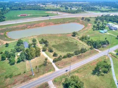 Harrah Acreage with Pond