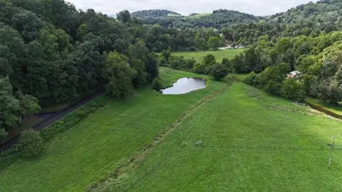 Fenced Agricultural Land With Barn