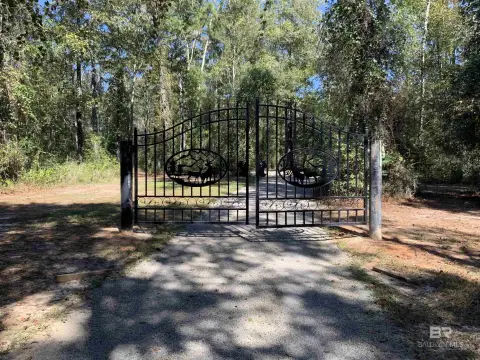Partially Cleared Acreage with Structures