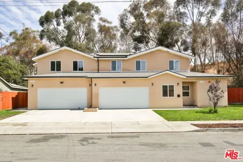 Contemporary Duplex with Two Garages