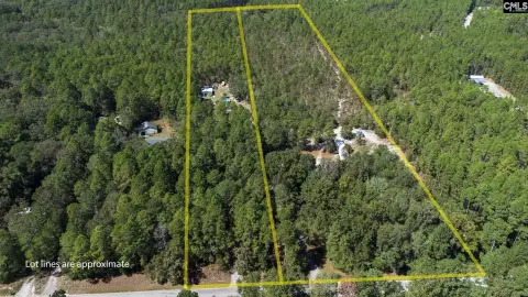 Spacious Acreage with Investment Potential