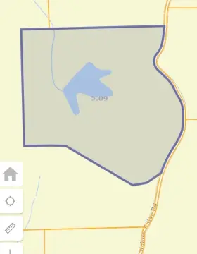 Heavily Wooded Land with Lake