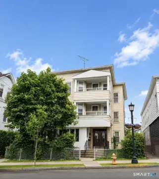 Triplex With Detached Four-Car Garage