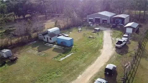 Vacant Land with Metal Building