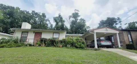 Occupied Duplex with Carports