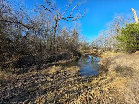 Mountain Land with Pond and Creek